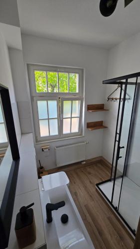 a bathroom with a sink and a window at Gutenacht Bahnhof in Weimar