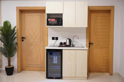 Η κουζίνα ή μικρή κουζίνα στο Tura Residence Sulimaniyah -ترى للشقق الفندقية السليمانية