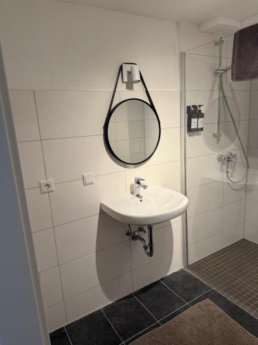 a bathroom with a sink and a mirror at Villa Rathenow in Rathenow