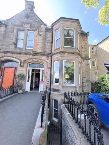 a house with a fence in front of it at Allison House 16 in Edinburgh