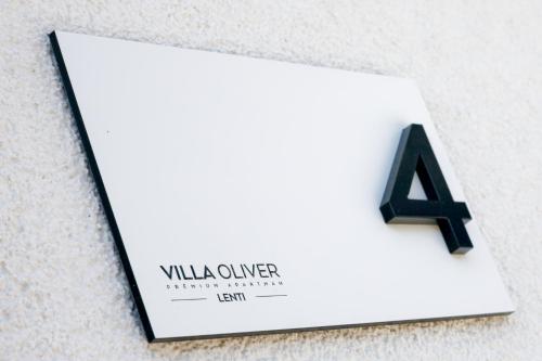 a sign for a building with the number four at Villa Oliver Lenti in Lenti