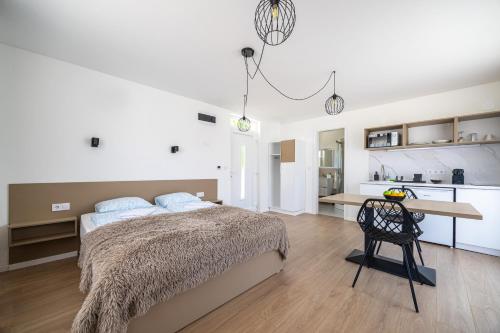 Postel nebo postele na pokoji v ubytování Villa Oliver Lenti