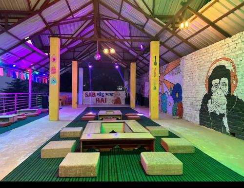 a bowling alley with a mural on the wall at malangbybumblebee in Kasol