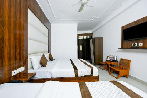 Postel nebo postele na pokoji v ubytování Airport Hotel Kiara - New Delhi Airport