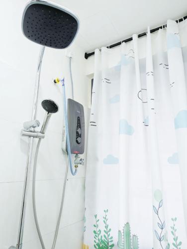 a shower curtain in a bathroom with a shower at Core Soho Suit Kip Sentral Kotawarisan Family Studio Near KLIA & KLIA2 in Sepang