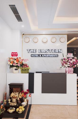 a sign that says the eastern hotel and apartments at The Eastern Hotel & Apartment in Hai Phong