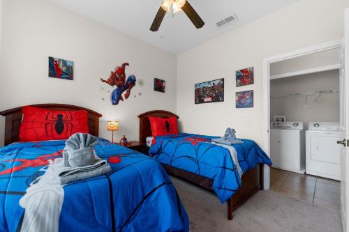 a bedroom with two beds and a spider man room at A hidden Gem in plain sight in Orlando