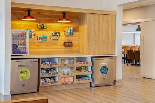 a store with two refrigerators in a room at Canalta Cochrane in Cochrane