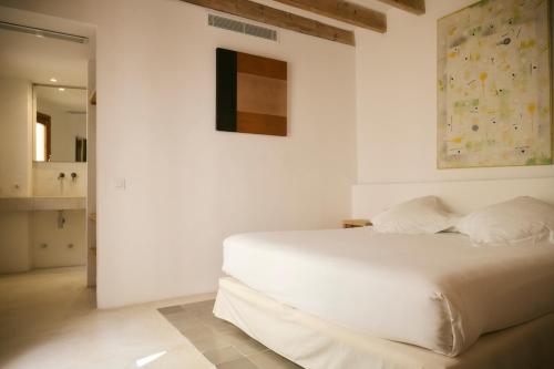Postel nebo postele na pokoji v ubytování Hotel Forn Nou