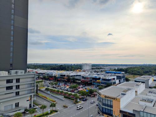 an aerial view of a city with a parking lot at Core Soho Suit Kip Sentral Kotawarisan Family Studio Near KLIA & KLIA2 in Sepang