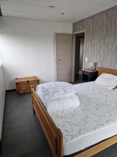 Postel nebo postele na pokoji v ubytování L'Harmonie du Jardin Gîte