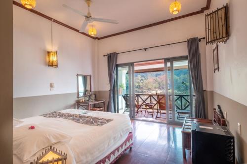 Voodi või voodid majutusasutuse The Sanctuary Pakbeng Lodge toas