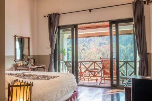Voodi või voodid majutusasutuse The Sanctuary Pakbeng Lodge toas