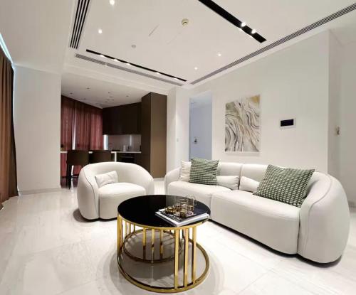a living room with a white couch and a table at Nicosia 360 Luxury Living A in Nicosia