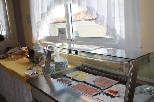 a kitchen with a counter with food on it at Terme Villa Pace in Abano Terme