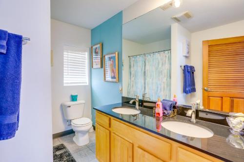 a bathroom with two sinks and a toilet at Cozy Middle Bass Island Getaway On Lake Eerie! in Put-in-Bay