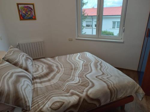 Postel nebo postele na pokoji v ubytování Apartma Mjrka