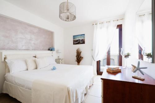 Postel nebo postele na pokoji v ubytování Appartamento Pineta Mare
