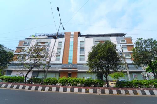 a building on the side of a street at Hotel Diamonds Pearl in Visakhapatnam