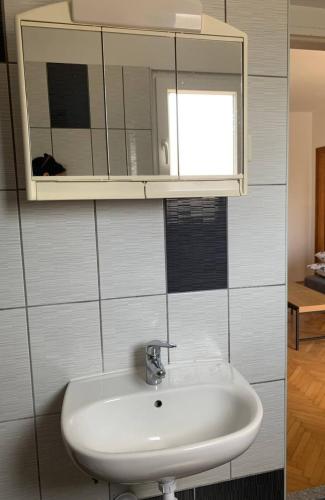 a bathroom with a sink and a mirror at Sunny in Split