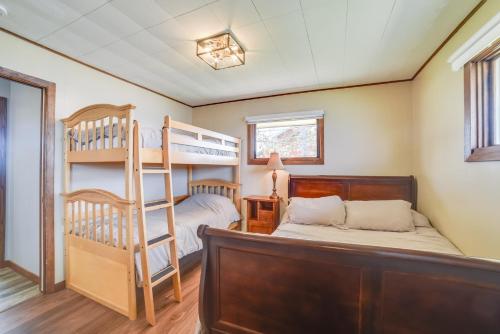 a bedroom with a bunk bed and a bunk ladder at BBQ Ready Lakefront Retreat in Watertown in Watertown