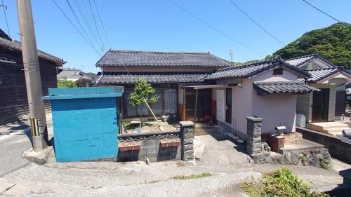 a small house with a blue object in front of it at Amakusa West Coast Takahama-ya - Vacation STAY 80953v in Amakusa