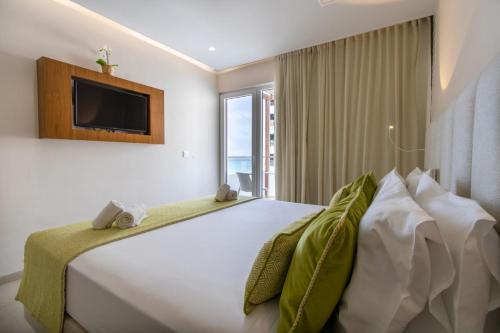 Postel nebo postele na pokoji v ubytování Luna Boutique Hotel