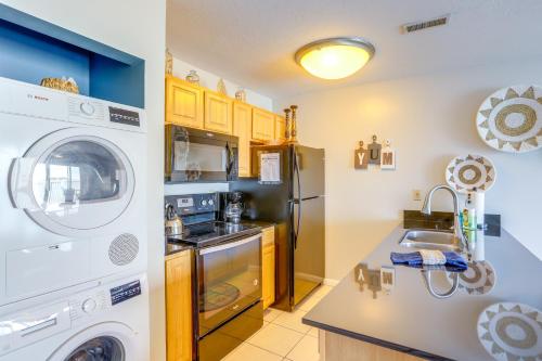 a kitchen with a washing machine and a washer at Cozy Lakefront Middle Bass Retreat with Balcony in Put-in-Bay