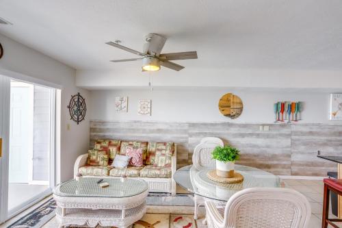 a living room with a couch and a table at Cozy Lakefront Middle Bass Retreat with Balcony in Put-in-Bay