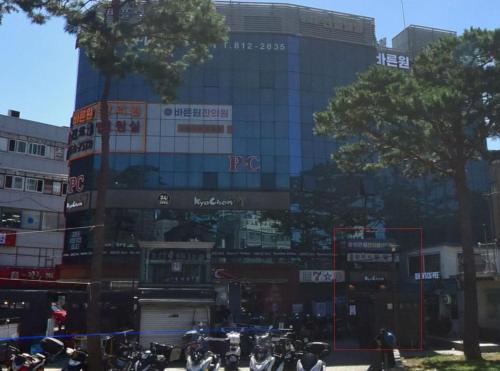 a group of motorcycles parked in front of a building at Extay Dongdaemun in Seoul