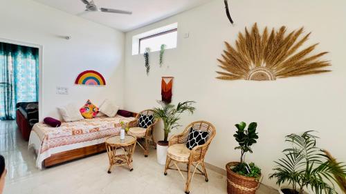 a bedroom with a bed and a table and chairs at Dhyani Residence in Nakraunda
