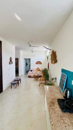 a large living room with a bed and a table at Dhyani Residence in Nakraunda