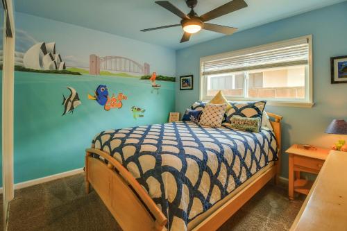 a bedroom with a bed and a ceiling fan at F-30 Small World in Anaheim
