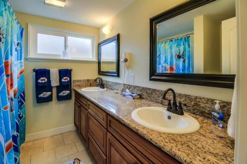 a bathroom with two sinks and a large mirror at F-30 Small World in Anaheim