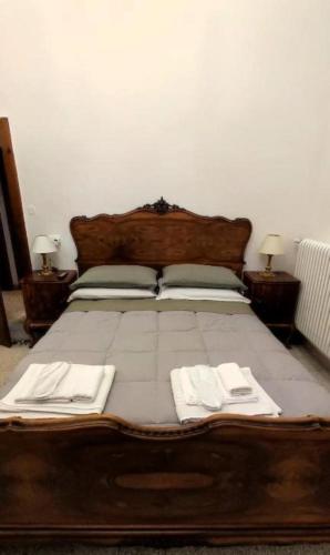 a bed with two white towels on top of it at La Dimora Di Anna in Chiusi