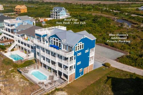 an aerial view of a large house with a swimming pool at Blue Haven | Oceanfront| Pool | Hot Tub | North Topsail Beach | Luxury Vacation Rental in North Topsail Beach