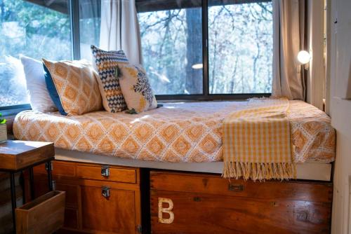 a bed sitting in a room with a window at Lake Lucerne 9 -Nauti or Nice in Eureka Springs