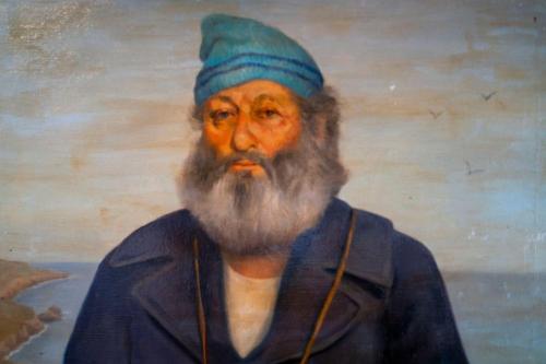 a painting of a man with a beard at Lake Lucerne 9 -Nauti or Nice in Eureka Springs