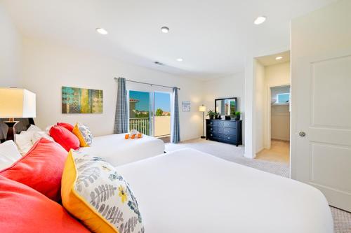 a living room with two beds and a red couch at F-56 Winnie the Poohs Treehouse in Anaheim