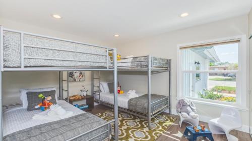 a bedroom with two bunk beds and a window at F-52 Trenton II in Anaheim