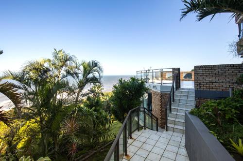 a balcony with a view of the beach at Hansmeyer Hill - 5 Bedroom House in Margate