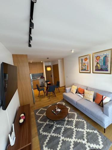 a living room with a couch and a table at Londres #187 in Mexico City