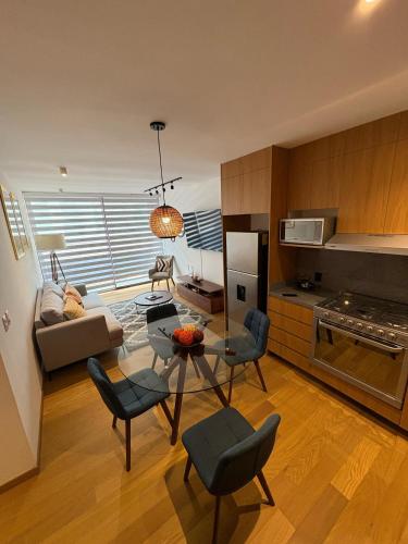 a living room with a couch and a table at Londres #187 in Mexico City