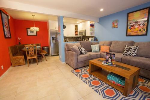 a living room with a couch and a table at Under the Sea by Funtierland Vacation Rentals in Anaheim