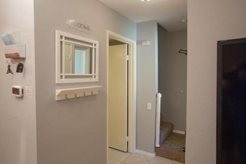 a hallway with a door and a window in a room at Radiator Springs by Funtierland Vacation Rentals in Anaheim