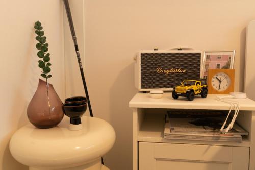 a desk with a computer and a toy truck on it at Forest Hangang in Seoul