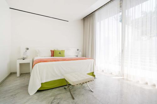 Ein Bett oder Betten in einem Zimmer der Unterkunft Anticavilla Hotel Restaurante & Spa
