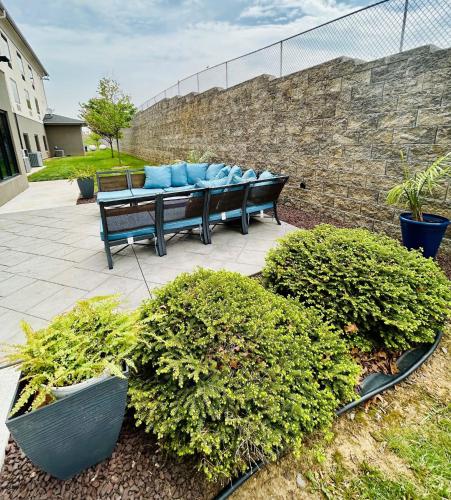 a group of benches sitting on a patio at Holiday Inn Express & Suites Shippensburg by IHG in Shippensburg