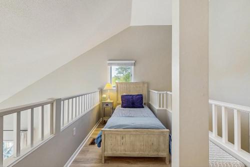a bedroom with a bed with a blue pillow at Sea Colony - 17001 Bayberry in Bethany Beach