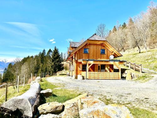 a log cabin in the middle of a field at Lärchenhaus ,,Unterer Brodl" in Kammersberg